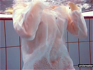 adorable red-haired plays naked underwater