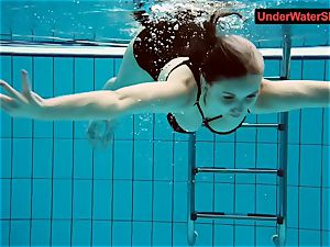 tatted baby swirls underwater